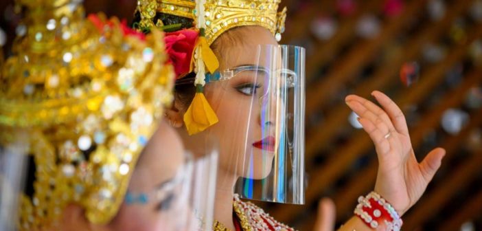Traditional Thai Dancers Performing in Face Shields